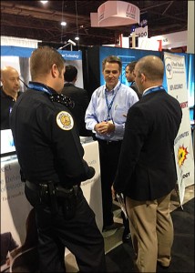 Converus President and CEO Todd Mickelsen talks with Georgia Tech police officers about EyeDetect technology.