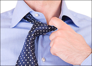 Someone pulling at their shirt collar is just one of many body language indicators of deception